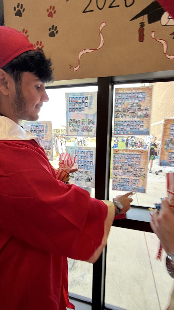 student looking at yearbook 