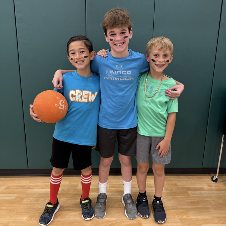 boys helping coach