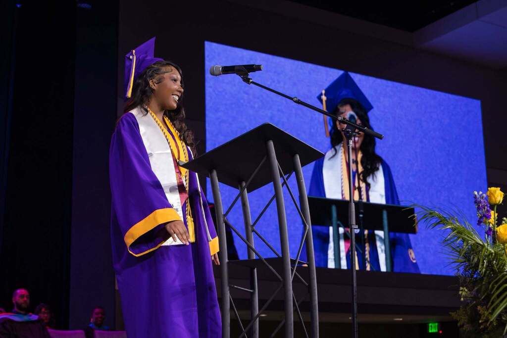 Senior gives speech at graduation ceremony.