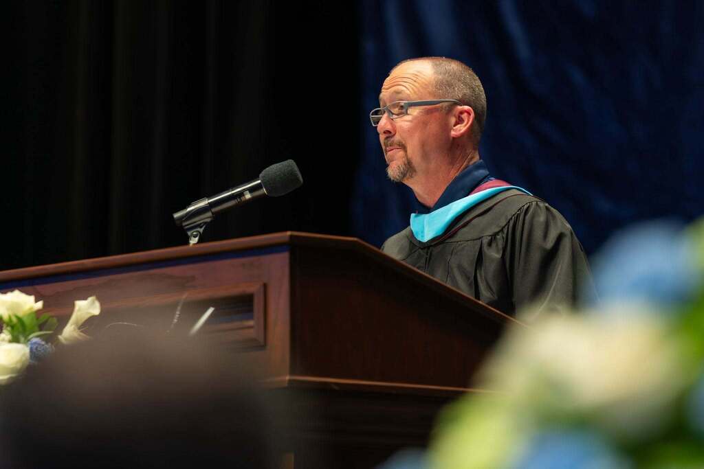 Principal give a speech at graduation.