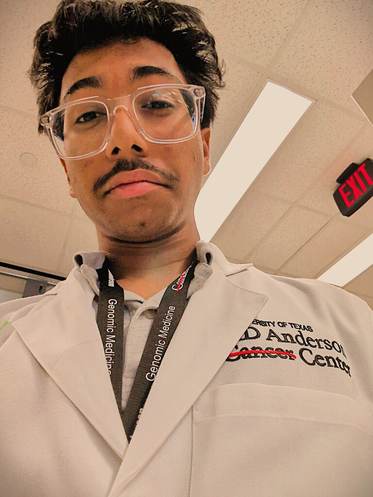 Selfie of Ayan in his MDA white lab coat.