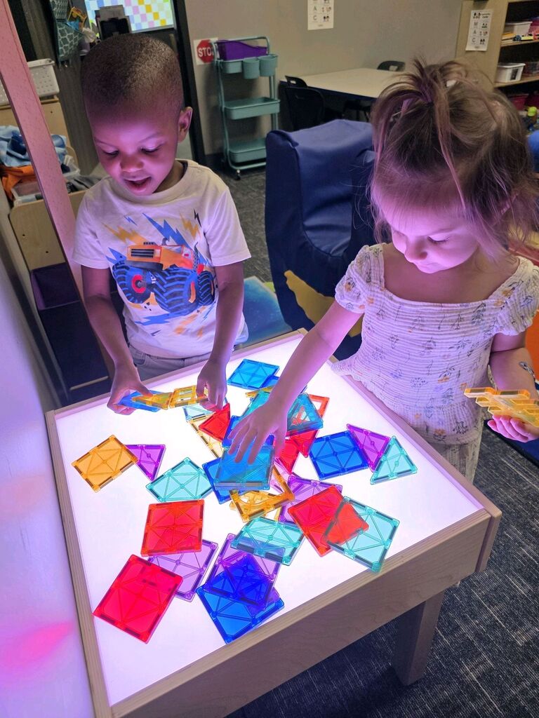 Early Childhood students exploring a center