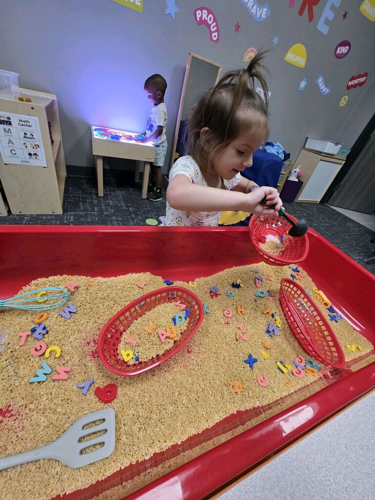Early Childhood students exploring a center