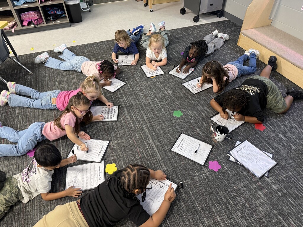PreK working on their letters