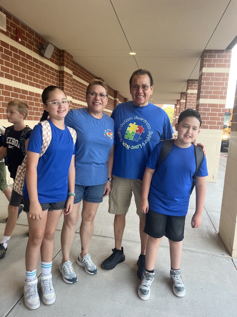 Students in blue for Mrs. Barber's birthday