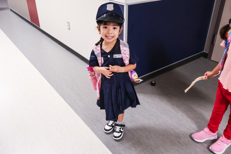 Student dressed as a police officer for career day.