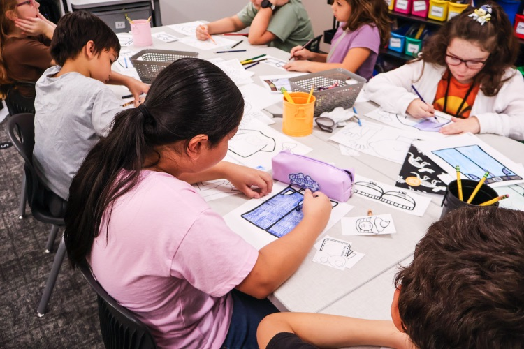 Students coloring future career activities in class.