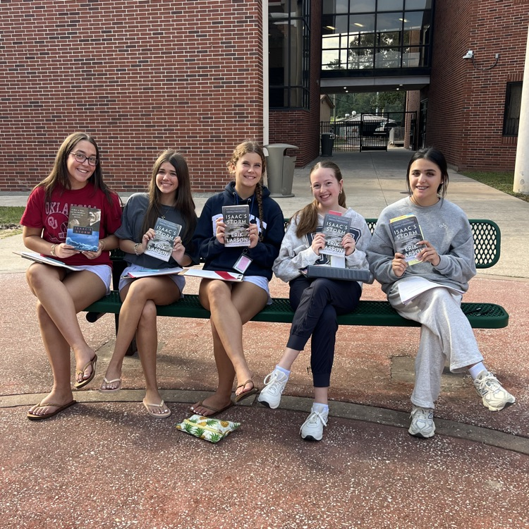 Today’s forecast: 100% chance of reading, sunshine, and a little irony! English 2 honors students were studying _Isaac’s Storm_ while enjoying some beautiful weather today! ☀️📖