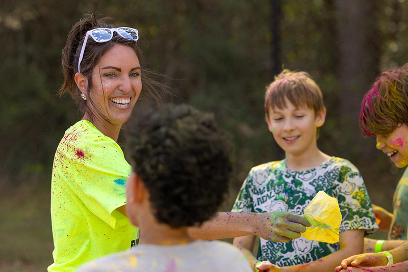 Mrs. Chelsea Harness with students at the Collins Intermediate Color Run