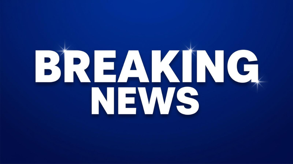 "Breaking News" in white letters on a blue background that fades to black