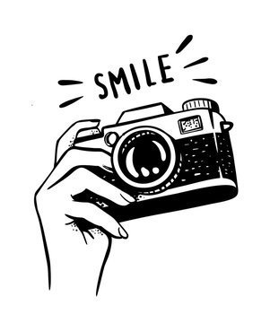 Camera with the word smile above it