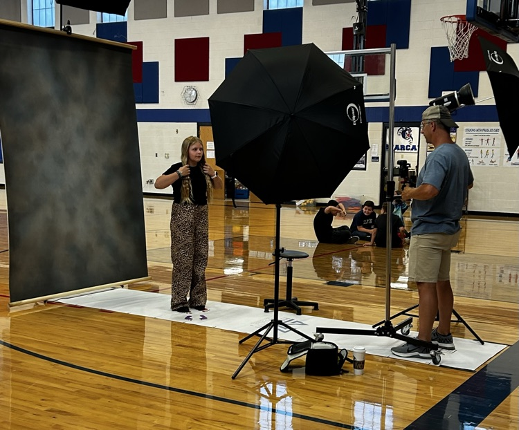 student getting her picture taken