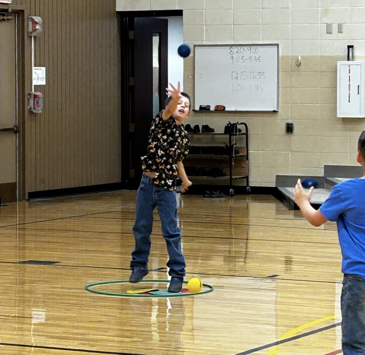 A male student throwing a ball.