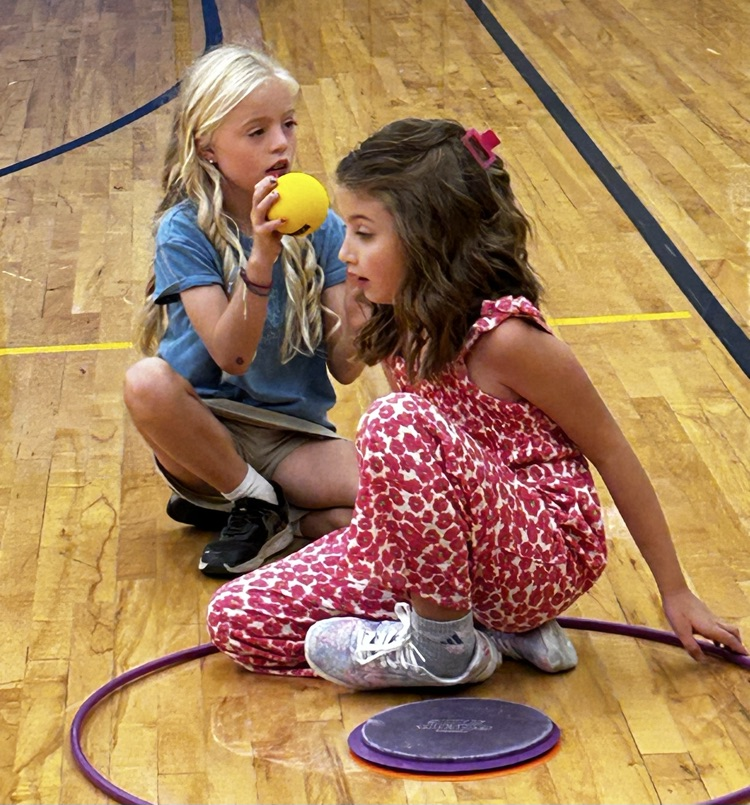 Girls waiting for a turn during PE
