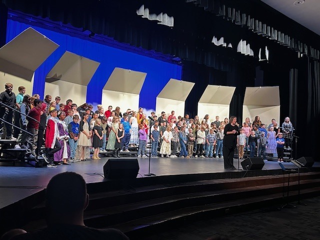 concert participants on stage