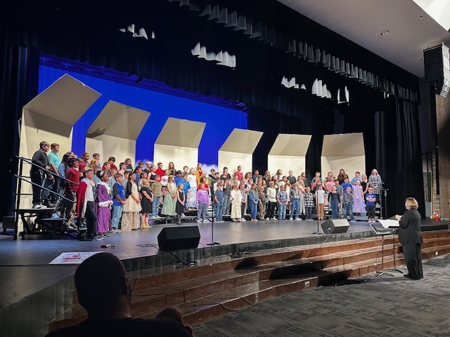 concert participants on stage