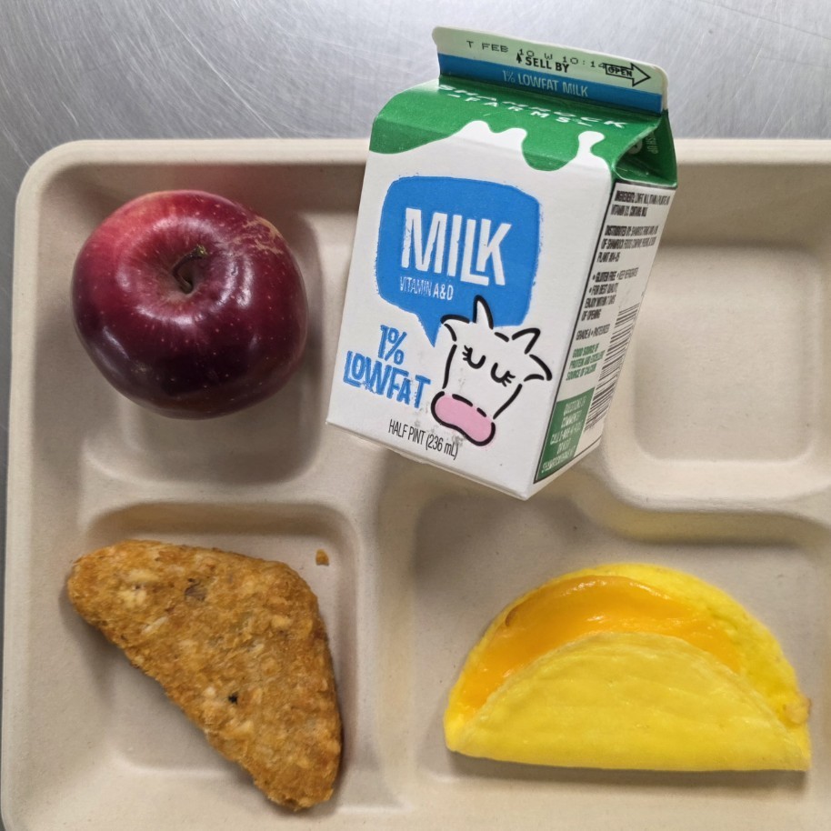 omelet, hash browns, apple, and milk