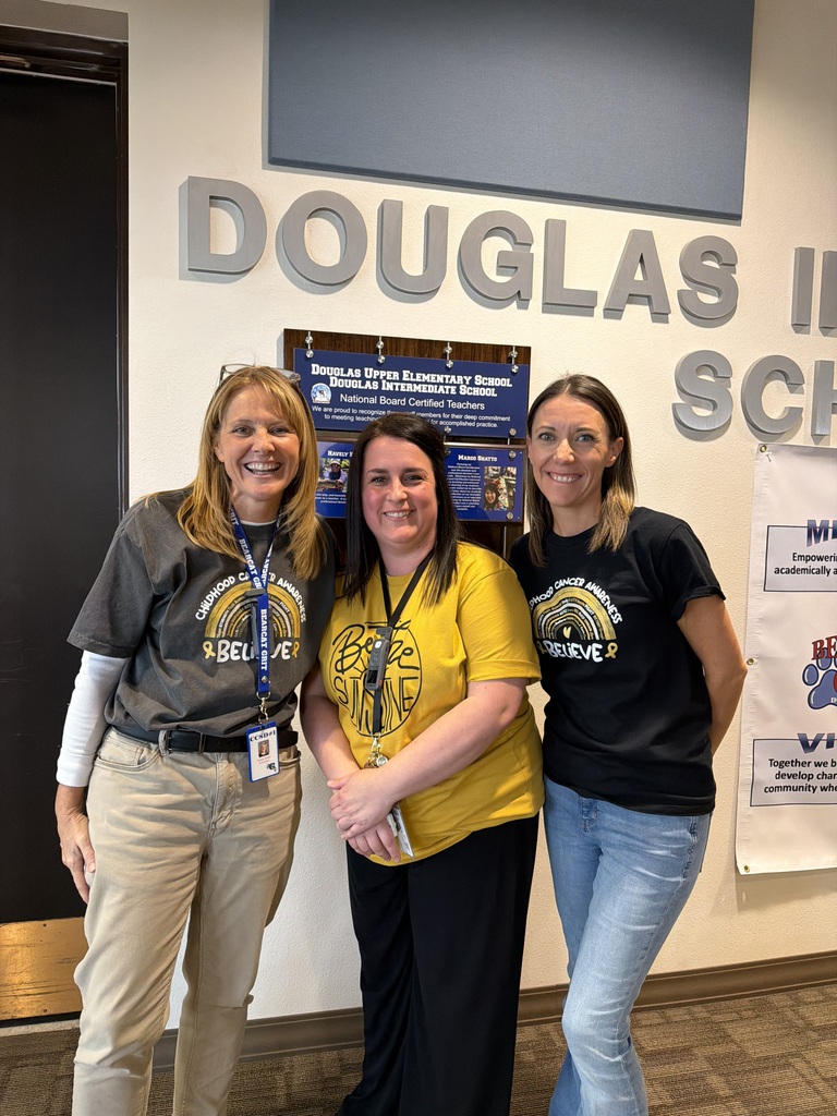 DIS/DUES staff dressed in gold