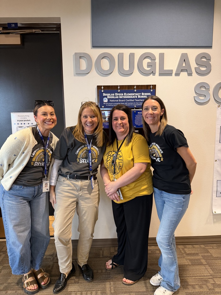 DIS/DUES staff dressed in gold
