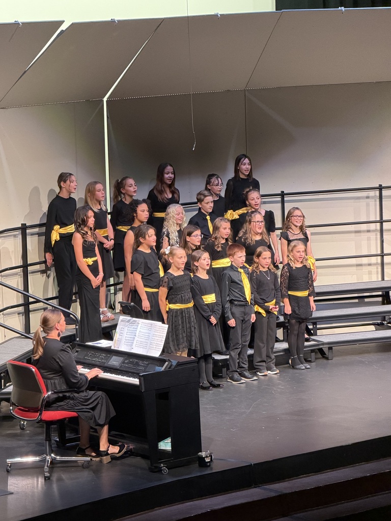 kids singing during a concert