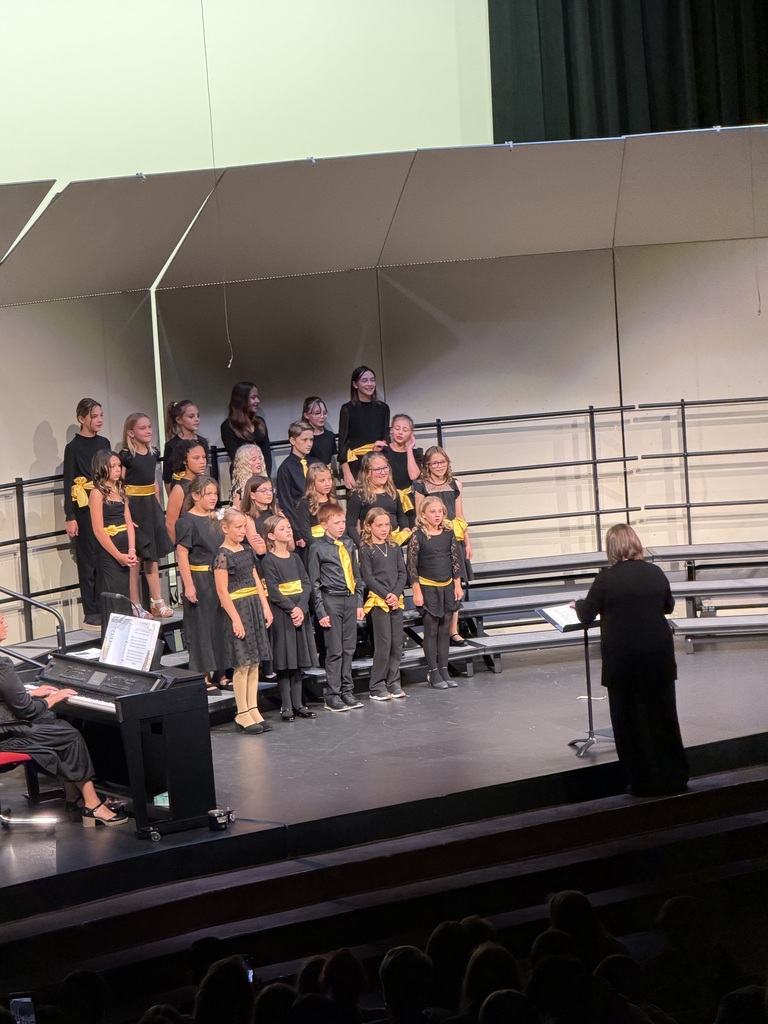 kids singing during a concert