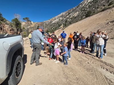 students outdoors learning about dams