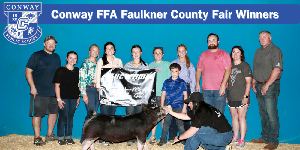 group picture with pig at fair