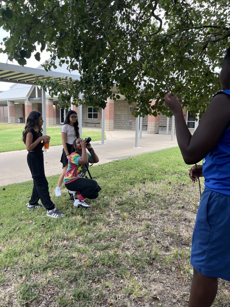 Yearbook students practicing Bird's Eye View and Worm's Eye View