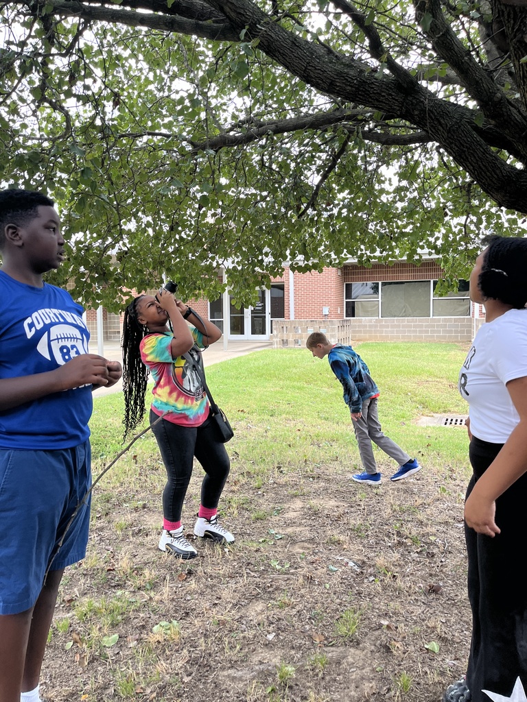 Yearbook students practicing Bird's Eye View and Worm's Eye View