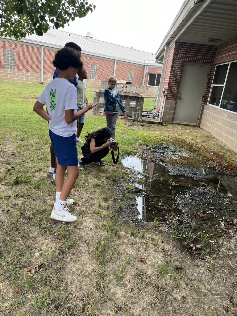 Yearbook students practicing Bird's Eye View and Worm's Eye View