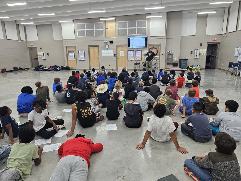 Mr. Gunsolus talking to his and Coach German's 5th grade D3 (Discipline, Determination, Dreams) groups about the importance of service and accountability. They are preparing to help serve at Fall Festival on October 24th.