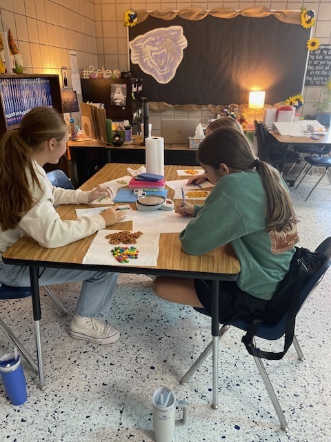 Mrs. Hunter's 7th Accelerated Sciences have been working with physical properties this week as they determined mass, volume, density, circumference, and height as they worked with some yummy and seasonal items. This was an opportunity for the students to demonstrate what they have learned during their Chemistry unit. Fun and great snacks were had by