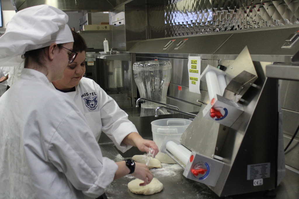 Student prepping dough.