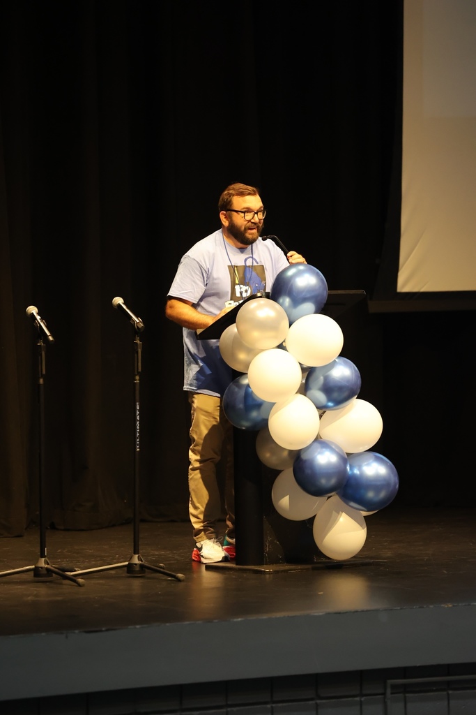 Staff member speaking to audience 