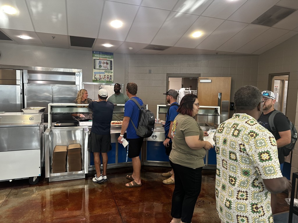 Staff in line waiting for breakfast