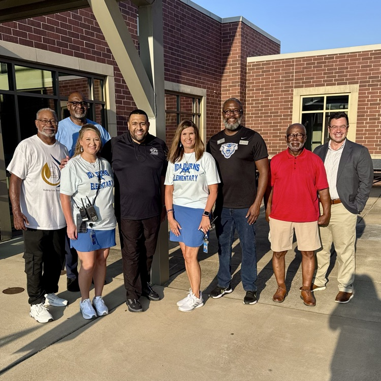 group of people greeting students