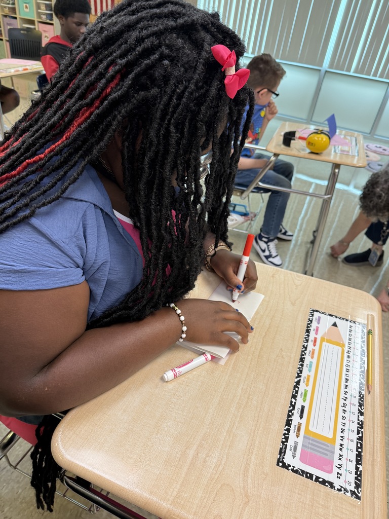 students working on a trifold