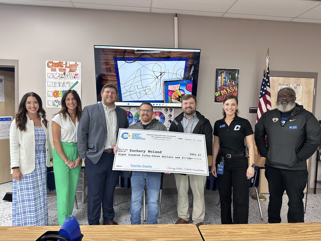 Mr. Noland with Grant Check