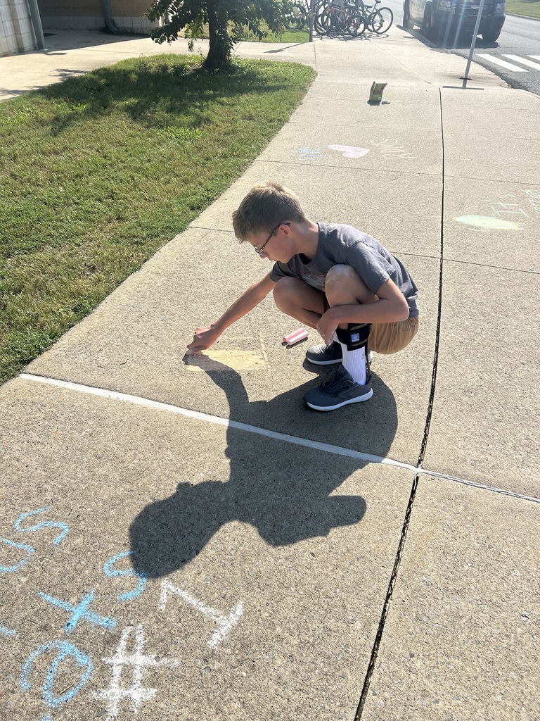 students using sidewalk chalk
