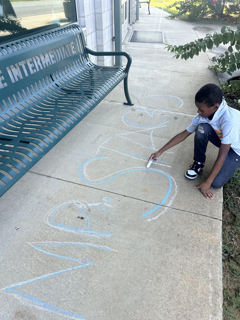 students using sidewalk chalk