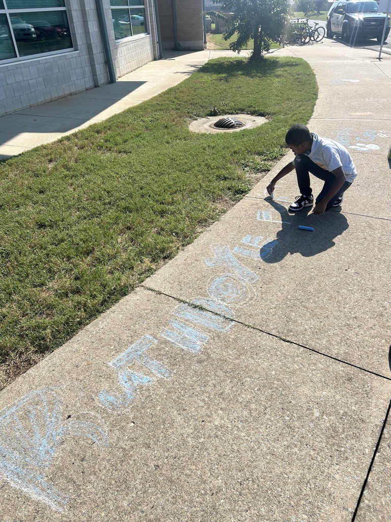 students using sidewalk chalk