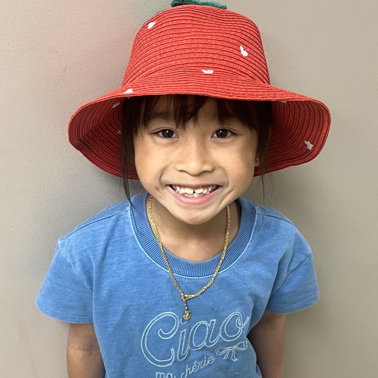 first grade child in hat