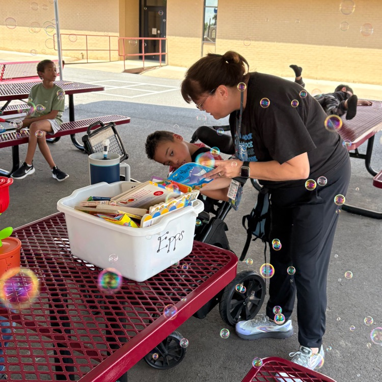 reading to student outside