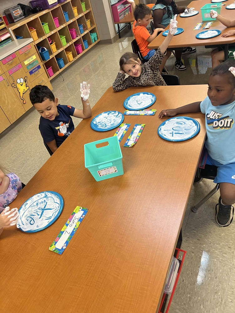 Mrs Adams class practiced our phonics High Frequency Words by writing them in shaving cream. 