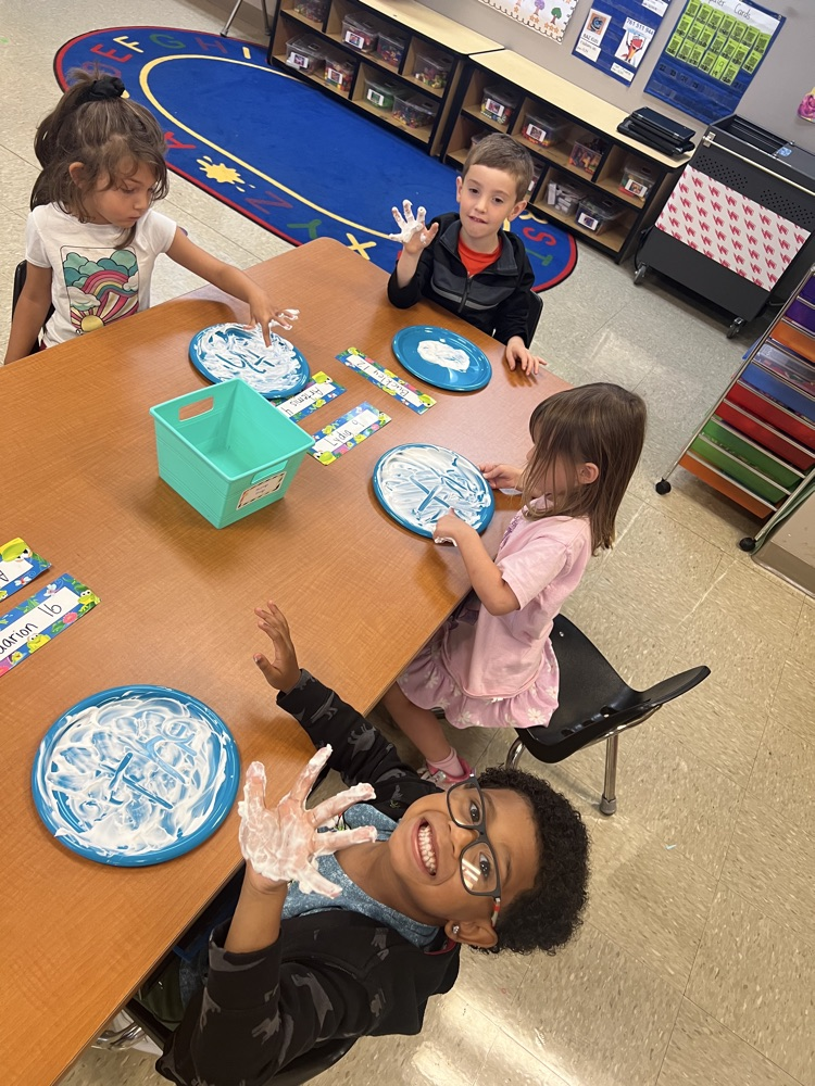 Mrs Adams class practiced our phonics High Frequency Words by writing them in shaving cream. 