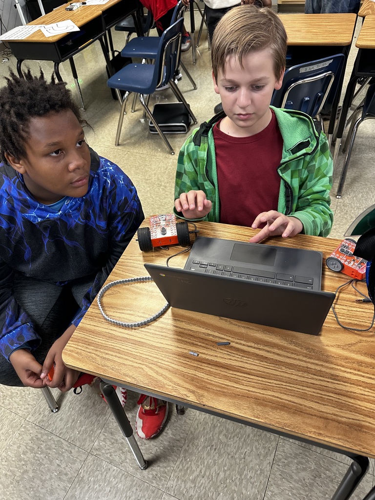 Students coding for robots
