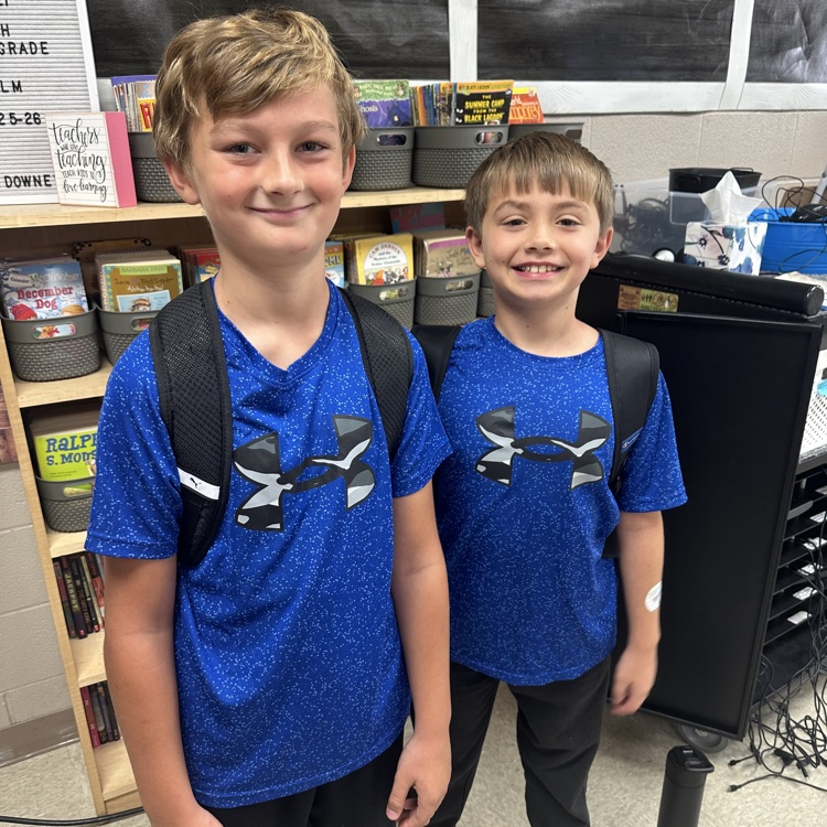 two boys matching in shirts 