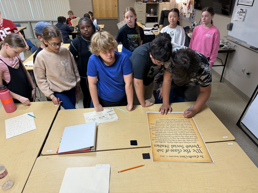 students signing posters