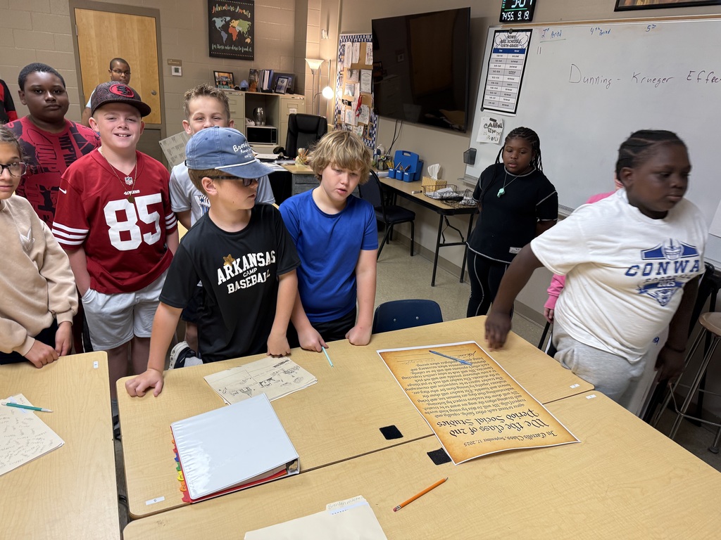 students signing posters