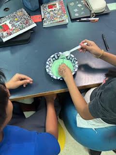 Students making Oobleck (green slime) in science class